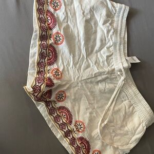 Embroidered White Shorts with Red and Gold Accents